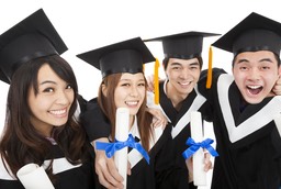 happy asian students graduating